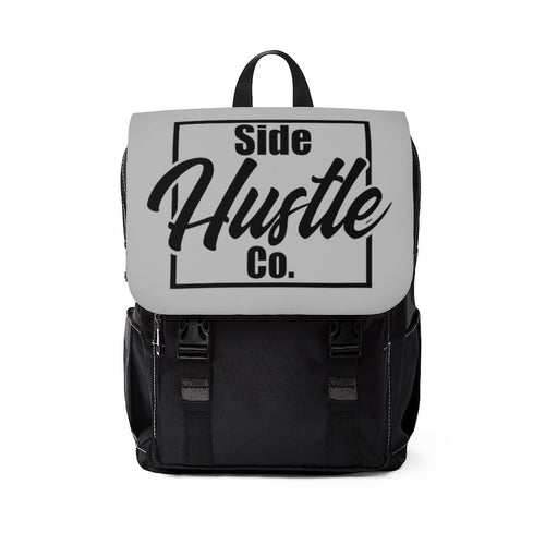 side hustle co black backpack with classic front flap with a knockout logo